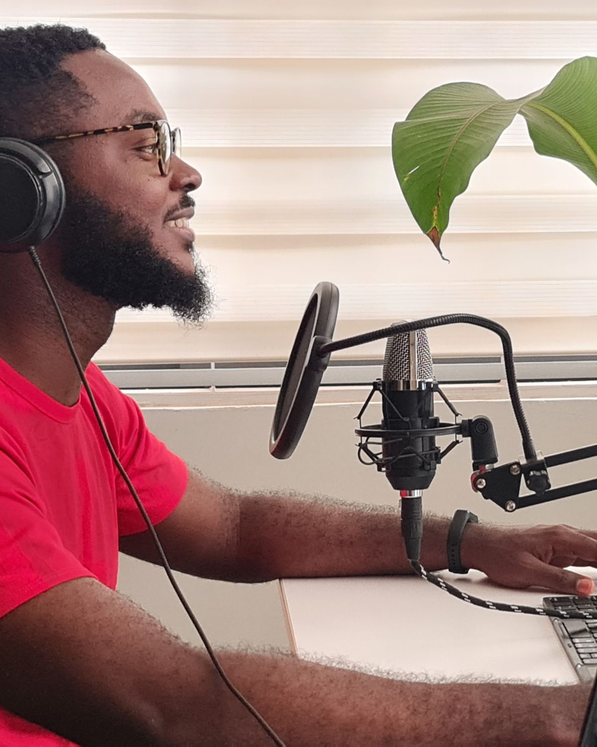 Specialist contributor recording a briefing at a studio microphone